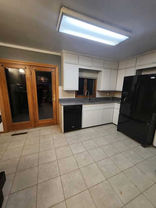 kitchen featuring black appliances, white cabinetry, a sink, and light tile patterned flooring