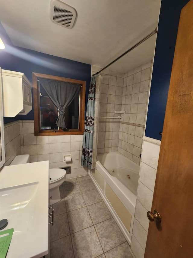 bathroom with shower / tub combo with curtain, tile walls, visible vents, toilet, and tile patterned floors