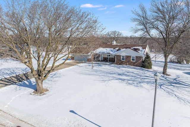 view of front of house featuring brick siding