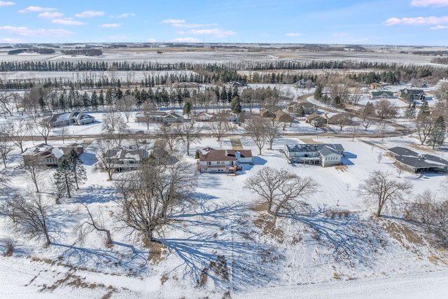 snowy aerial view featuring a residential view