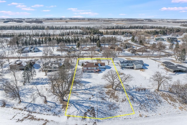 snowy aerial view featuring a residential view