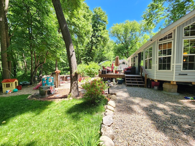 view of yard featuring a wooden deck