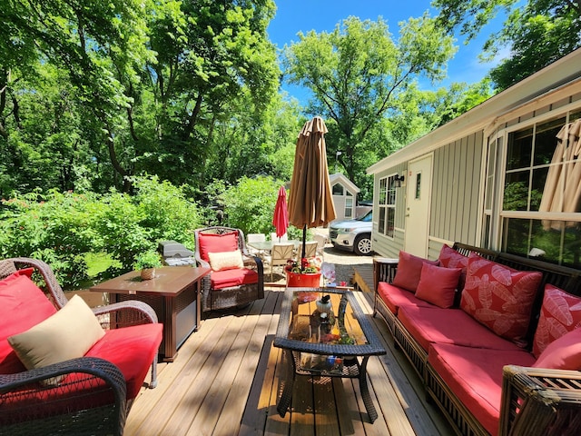 wooden terrace with an outdoor hangout area