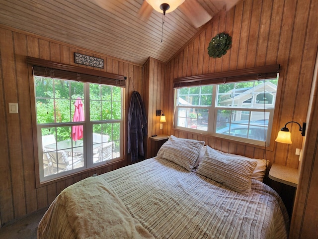 bedroom featuring wooden ceiling, vaulted ceiling, and wood walls