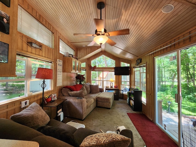 sunroom with ceiling fan, wood ceiling, and vaulted ceiling