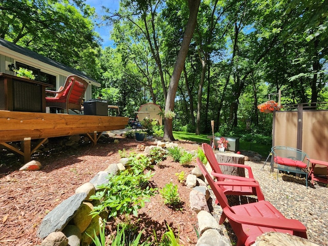 view of yard with an outbuilding and a shed