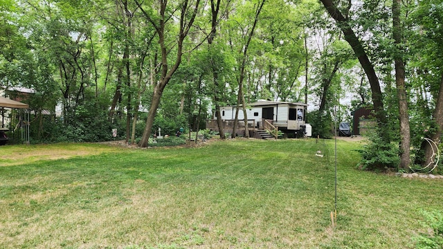 view of yard featuring a wooden deck