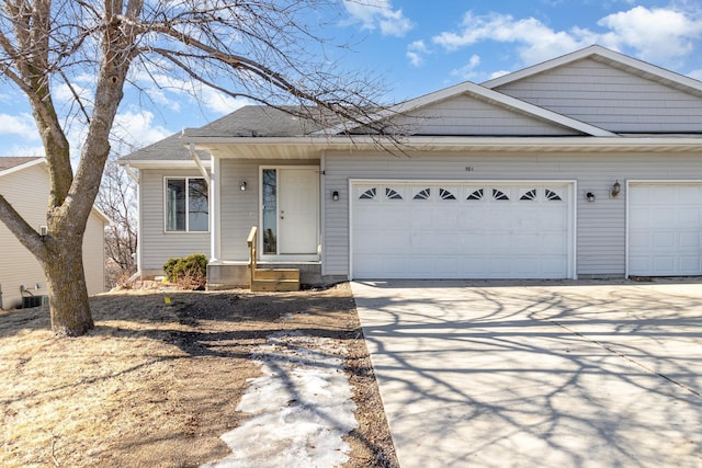 view of front of home with driveway and an attached garage