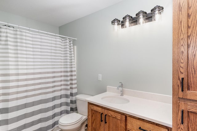 bathroom with toilet and vanity