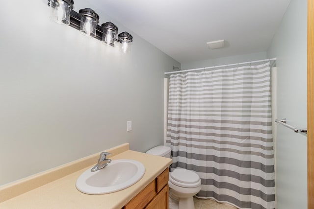 full bathroom featuring curtained shower, vanity, toilet, and tile patterned floors