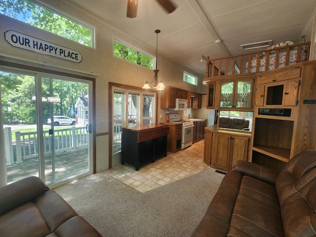 2945 County Road 4 SW Unit 118, Cokato, MN 55321 - living area featuring a ceiling fan, a high ceiling, light carpet, and a chandelier