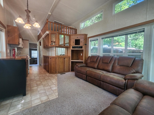 2945 County Road 4 SW Unit 118, Cokato, MN 55321 - living area with a chandelier, a high ceiling, and light tile patterned floors