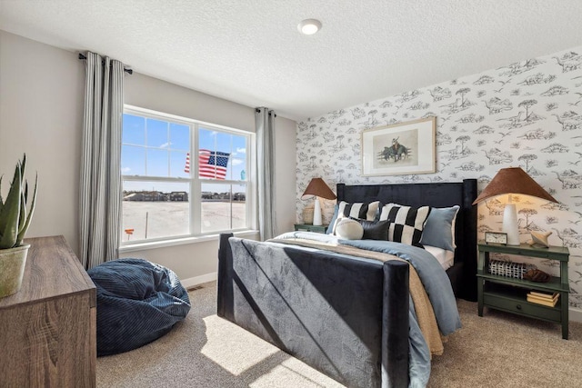 carpeted bedroom featuring wallpapered walls, baseboards, and a textured ceiling