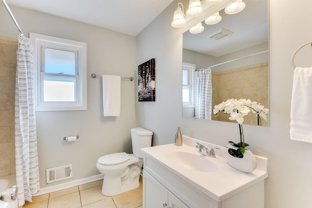 bathroom with toilet, visible vents, and a wealth of natural light