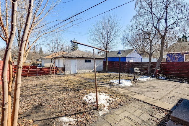 view of yard featuring a patio area and a fenced backyard