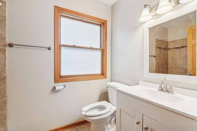 bathroom featuring baseboards, tiled shower, toilet, tile patterned flooring, and vanity