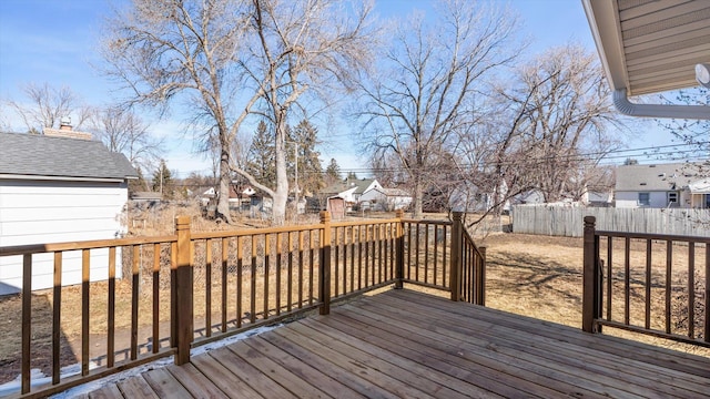 wooden terrace with fence and a residential view