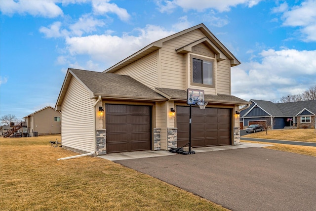 traditional home with stone siding, aphalt driveway, a front lawn, and roof with shingles