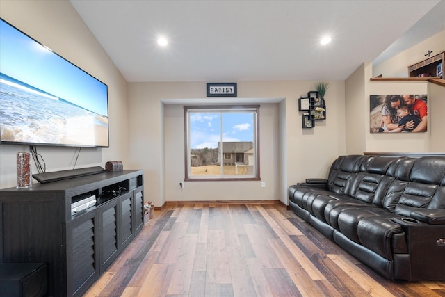 home theater with light wood-style floors, baseboards, and recessed lighting