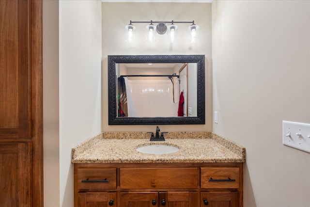 bathroom featuring a shower with curtain and vanity