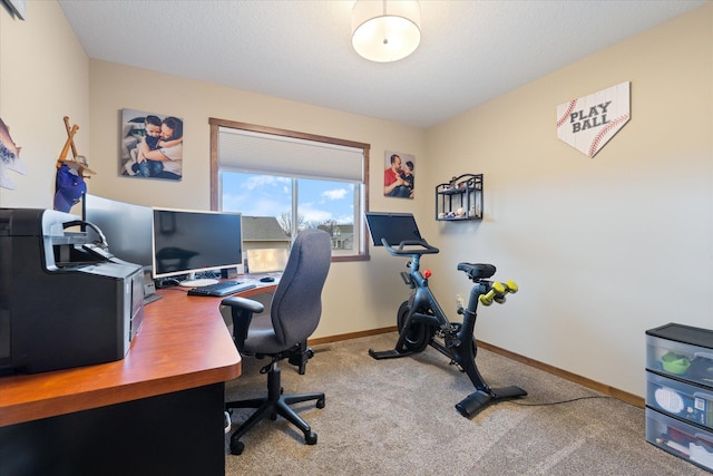 office area with carpet, a textured ceiling, and baseboards