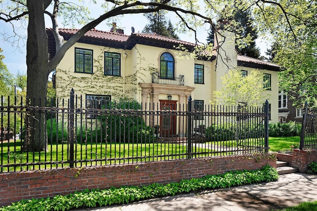 1769 Dupont Ave S Unit 1, Minneapolis, MN 55403 - mediterranean / spanish house with a chimney, stucco siding, and a tile roof