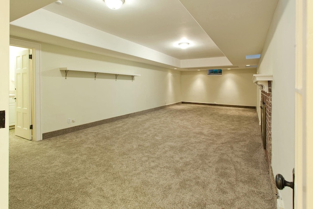 1769 Dupont Ave S Unit 1, Minneapolis, MN 55403 - finished below grade area featuring carpet flooring, baseboards, and a brick fireplace