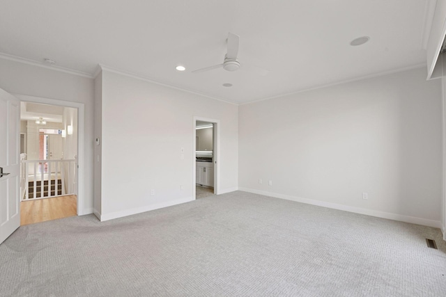 unfurnished bedroom with light carpet, baseboards, and crown molding