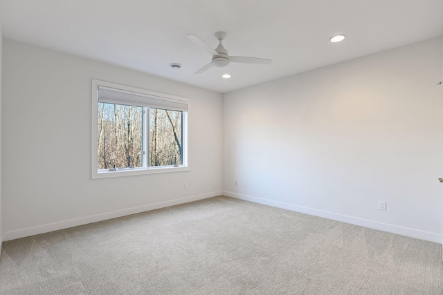 empty room with recessed lighting, ceiling fan, baseboards, and light colored carpet