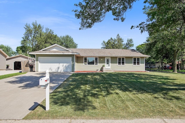 ranch-style home featuring a front lawn, a garage, and driveway