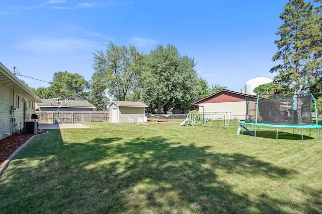 view of yard featuring cooling unit, a shed, an outdoor structure, a playground, and a trampoline