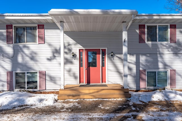 view of snow covered property entrance