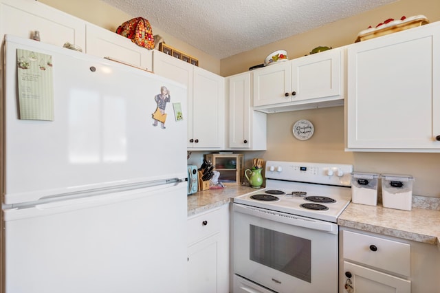 kitchen with white appliances, white cabinetry, light countertops, and a textured ceiling