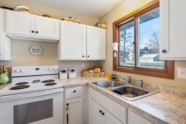 kitchen with light countertops, a sink, white electric range oven, and white cabinetry