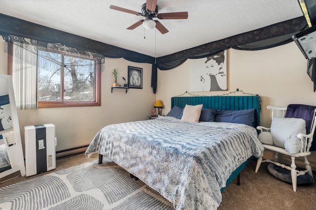 bedroom with carpet floors, a baseboard heating unit, and a textured ceiling