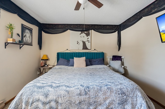 bedroom with a ceiling fan, a textured ceiling, and baseboards