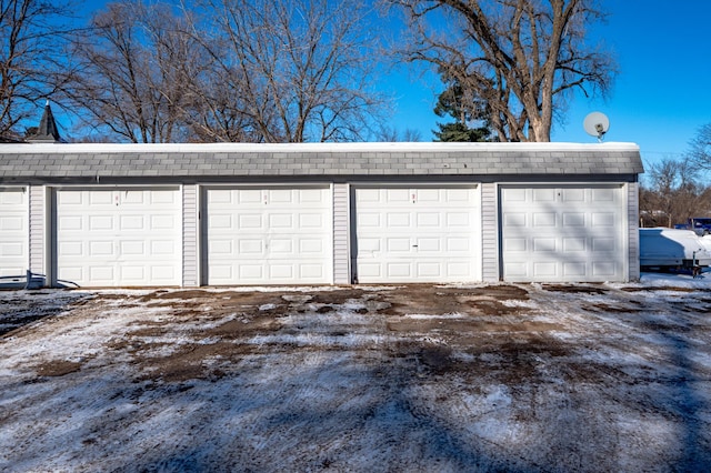 view of snow covered garage