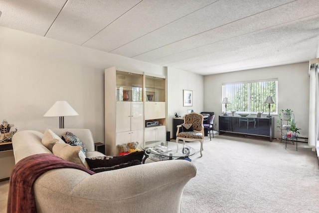 living room with a textured ceiling and carpet floors