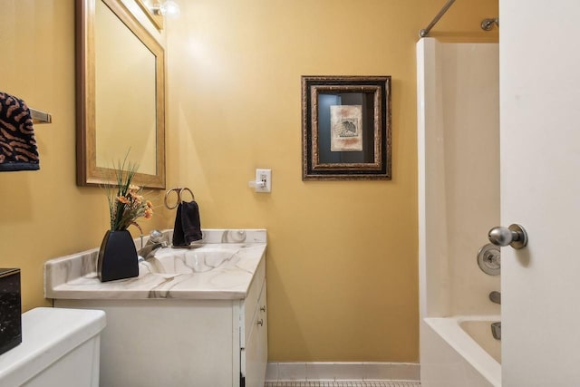 bathroom featuring toilet, tub / shower combination, and vanity