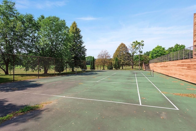 view of sport court with fence