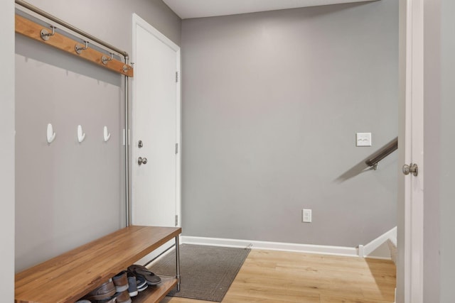 mudroom featuring baseboards and wood finished floors