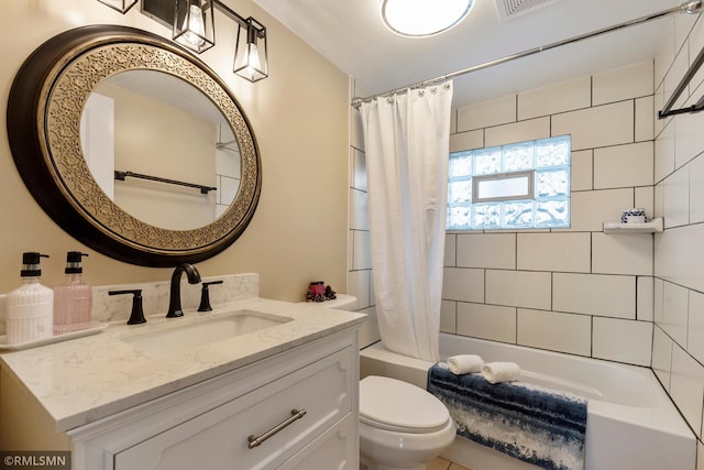 bathroom featuring vanity, toilet, and shower / bath combo with shower curtain