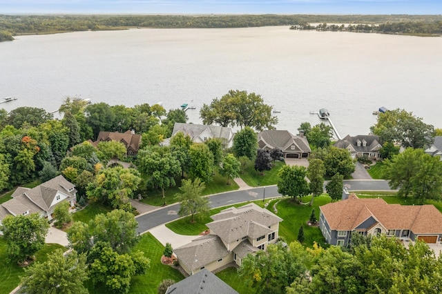 birds eye view of property featuring a water view and a residential view