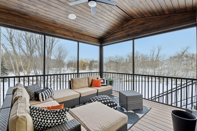 sunroom / solarium with wood ceiling, vaulted ceiling, and ceiling fan