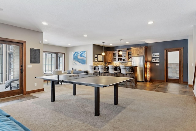 rec room featuring carpet floors, recessed lighting, and tile patterned floors