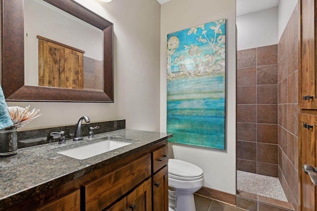 full bathroom with toilet, tile patterned floors, walk in shower, and vanity