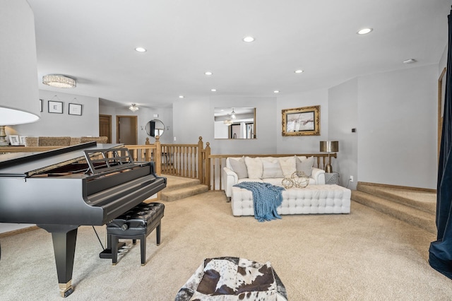 living area with light carpet, stairway, and recessed lighting