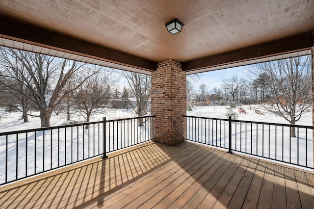 view of snow covered deck