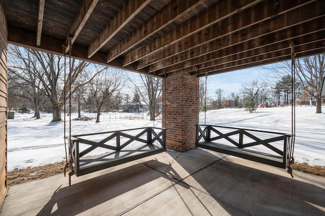 view of snow covered patio