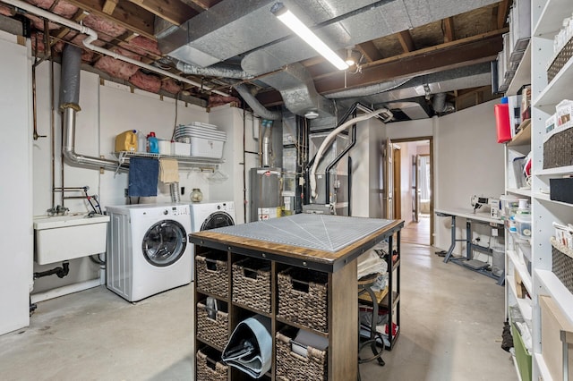 unfinished below grade area featuring water heater, independent washer and dryer, and a sink